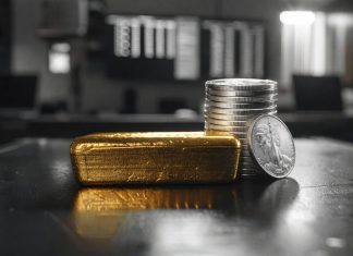 Gold und Silber erreichen neue Rekorde – strukturelle Kräfte treiben Rally Goldbarren und Silbermünzen im Handelsraum – Symbol für steigende Gold- und Silberpreise