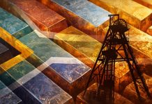 Gold-Absatz in Südafrika bricht im November ein – Platin-Metalle deutlich stärker Gold- und Platinbarren mit Bergbauturm und Südafrika-Flagge symbolisieren den Rohstoffmarkt