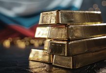 Goldbarren vor Russland-Flagge – Russland erwägt Rückkehr ins US-Dollar-System